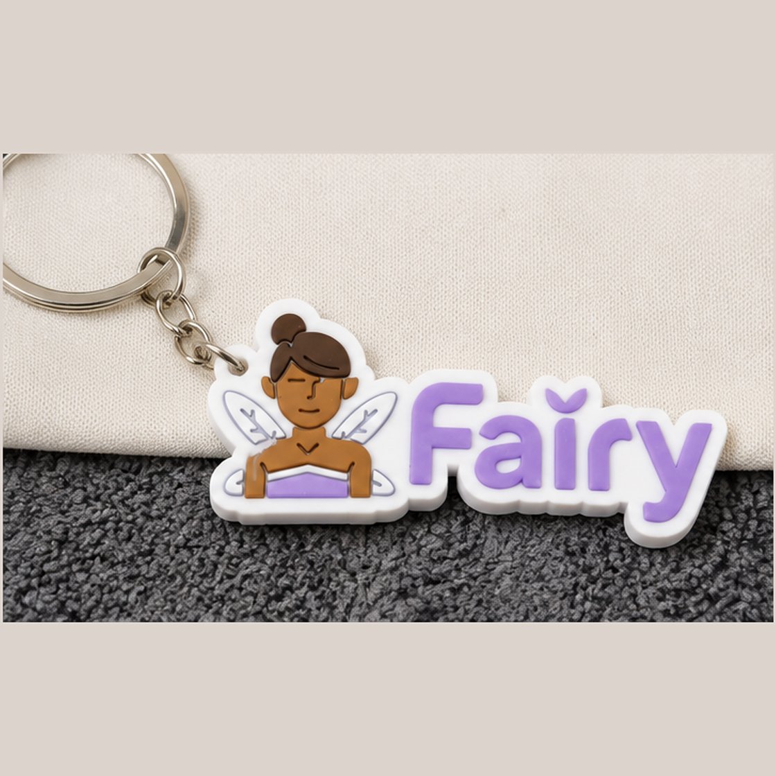 Fairy 3D PVC keychain with fairy icon and wordmark